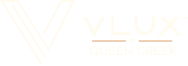 Logo For V LUX At Queen Creek Apartments featuring a V and text reading 'V LUX at Queen Creek'